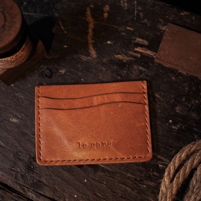 Personalized light-brown leather wallet for travel and business
