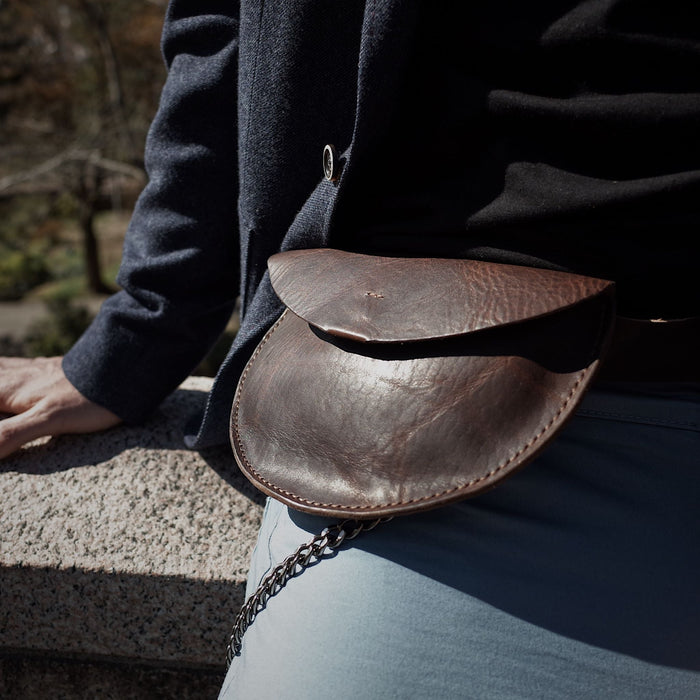 Stylish chestnut leather moon bag for everyday carry
