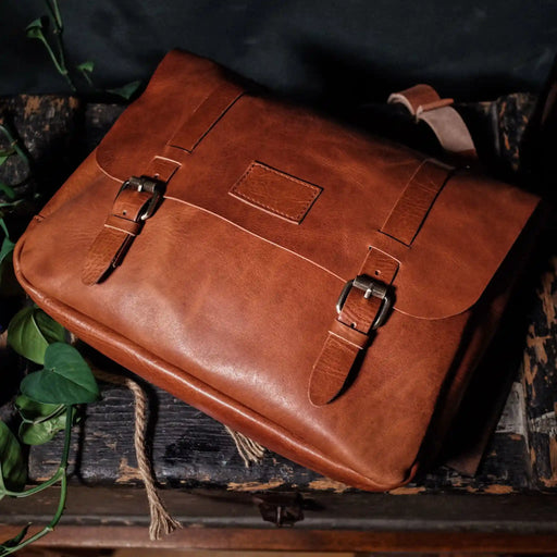 Minimalist full-grain caramel leather messenger bag for men and women
