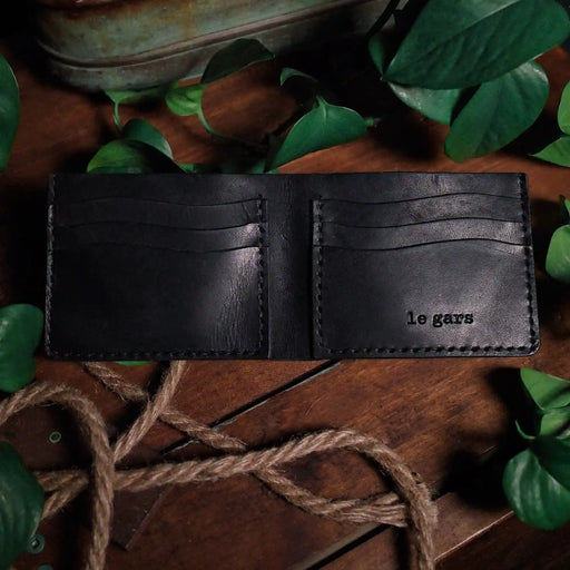 Minimalist full-grain black leather bifold wallet for men and women
