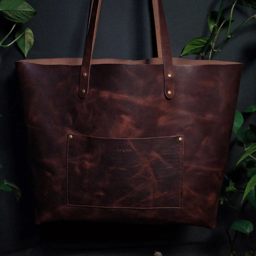 Minimalist full-grain chocolate leather shoulder bag for everyday use
