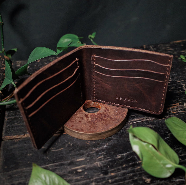 Durable coffee brown leather bifold wallet for men’s everyday essentials
